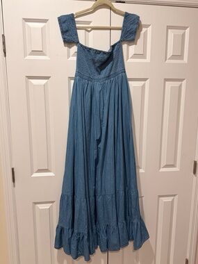 Strapless dress with upper arm sleeves. Worn Once.